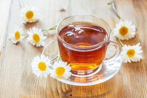 Cup of tea with chamomile Stock Photos