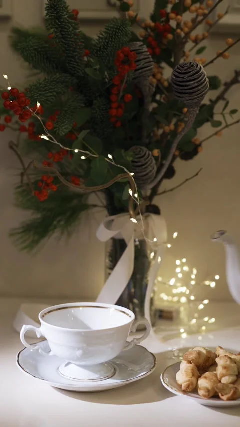 Cup of tea close-up. Decorated christmas tree on background Stock Footage 224895657