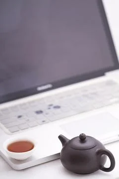 A cup of tea with the computer Stock Photos