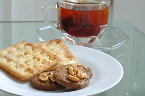 Cup of tea with cookie and bread, tea-break. Stock Photos