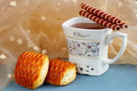 A cup of tea with delicious sweets on the table 写真素材