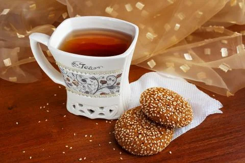 A cup of tea with delicious sweets on the table Stock Photos