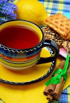 Cup of tea with dessert served. Stock Photos