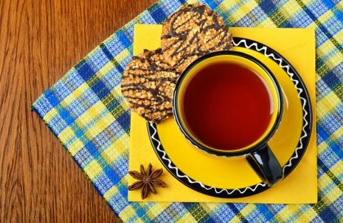 Cup of tea with dessert served. Stock Photos