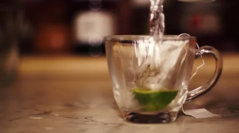 Cup of tea with falling water Stock Footage 63175539