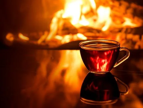 Cup of tea by the fireplace Stock Photos