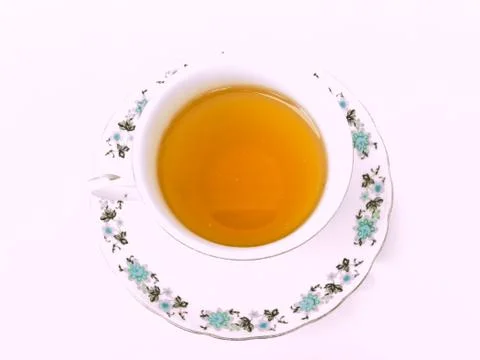A cup of tea with floral pattern isolated on white background Stock Photos
