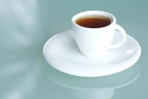 Cup of tea on a glass surface Stock Photos