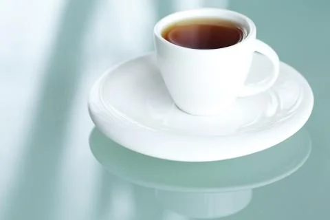 Cup of tea on a glass surface Stock-Fotos