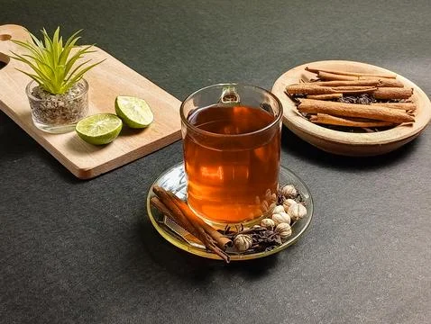 A cup of tea isolated on black with lemonade  Stock Photos