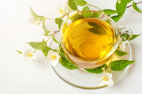 Cup of tea with jasmine on table close-up Stock Photos