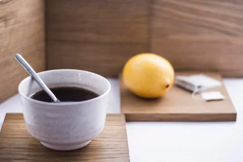 Cup of tea with lemon on the background Stock Photos