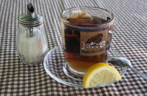 Cup of tea with a lemon Stock Photos