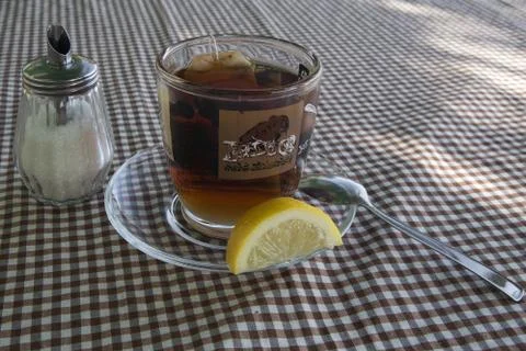 Cup of tea with a lemon Stock Photos