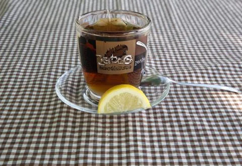 Cup of tea with a lemon Stock Photos