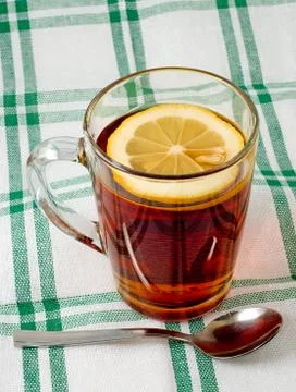 Cup of tea with a lemon Stock Photos