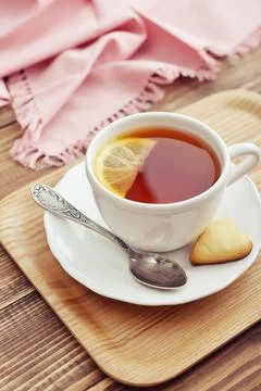 Cup of tea with lemon Stock Photos