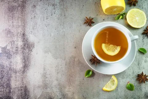 Cup of tea with lemon on table close-up Photos