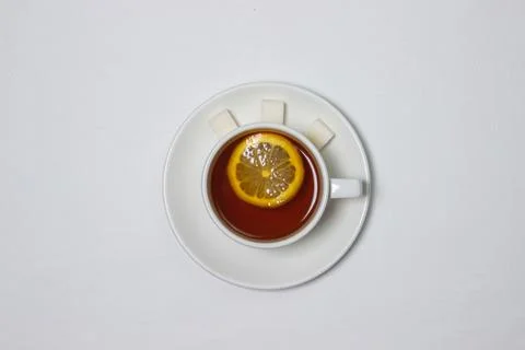 A cup of tea with lemon on a white background Stock Photos