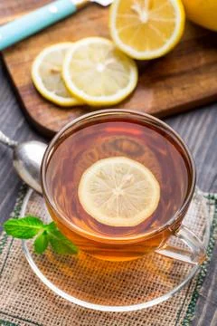 Cup of tea with mint and lemon Stock Photos