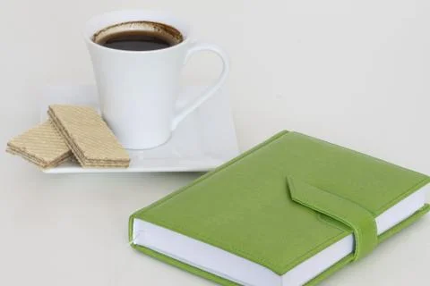 Cup of tea with notebook Stock Photos
