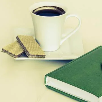 Cup of tea with notebook Stock Photos