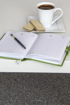 Cup of tea with notebook Stock Photos