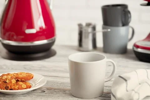 Cup of tea or coffee on modern kitchen background Stock Photos