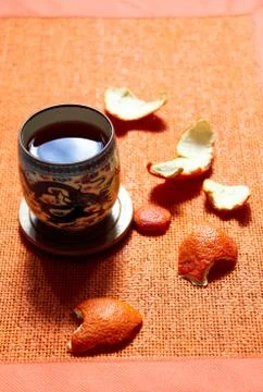 A cup of tea with orange peel. Stock Photos