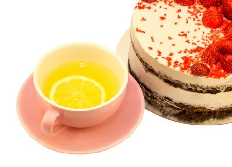 A cup of tea with a single piece of lemon Stock Photos