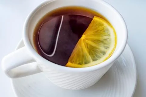 Cup of tea with sliced lemon Stock Photos
