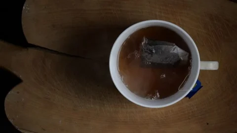 A cup of tea with smoke in slow motion Stock Footage 240114002