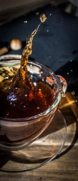 Cup of tea with splash Stock Photos