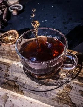 Cup of tea with splash Stock Photos