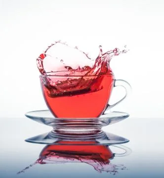 Cup of tea with splashes Fotos Stock