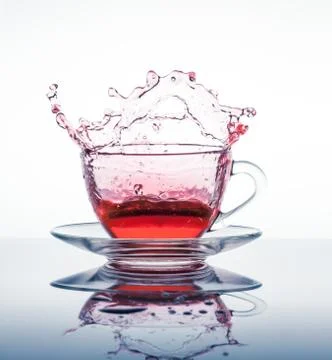 Cup of tea with splashes Fotos Stock