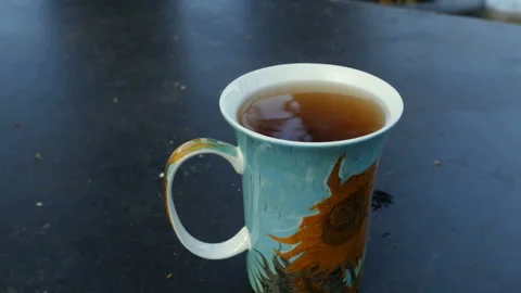 Cup of tea with steam Stock Footage 143484970