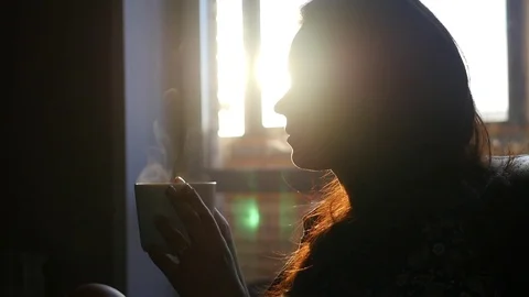 Cup of tea with steam in the hands of Stock Footage 70280319
