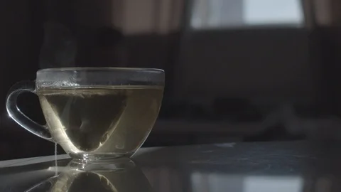 Cup of tea with steam. Loop Stock Footage 120747733