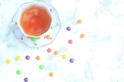 Cup of tea with sweets on a light background. Stock Photos