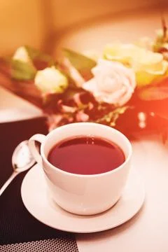 Cup of tea on the table. Breakfast time. Food photo with flare Stock Photos