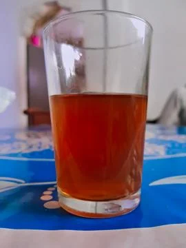 A cup of tea on the table, a close snapshot of a cup of tea on the table wearing 스톡 사진
