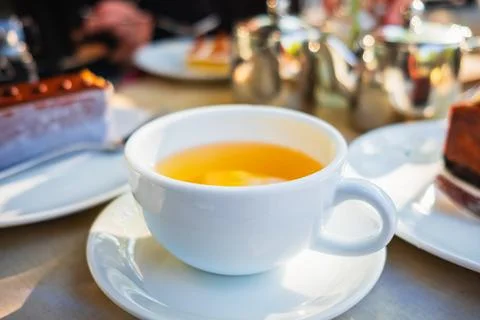 Cup of tea on the table. Hot drink with dessert in the kitchen. Cup of herb.. Stock Photos
