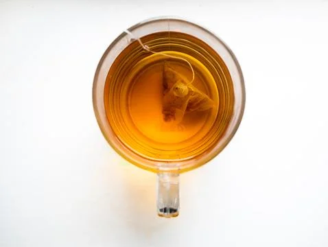 A cup of tea with a tea bag in it Stock Photos
