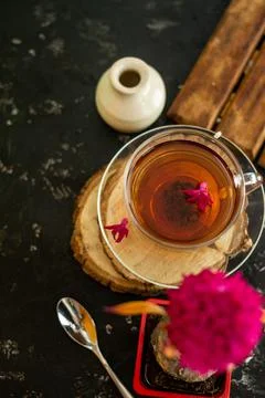 A cup of tea in a transparent cup with spring hyacinth flower on a black back Stock Photos