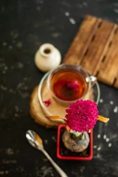 A cup of tea in a transparent cup with spring hyacinth flower on a black back Stock Photos