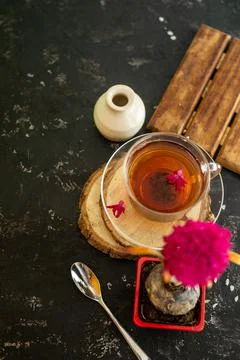 A cup of tea in a transparent cup with spring hyacinth flower on a black back Stock Photos