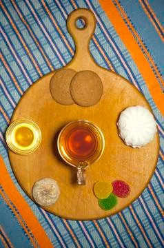 Cup of tea with various sweets Stock Photos
