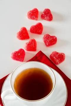 Cup of tea on a white background and red marmalade Stock Photos