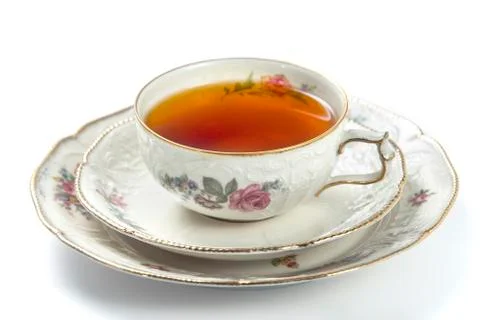 Cup of tea on a white background, closeup side view Stock Photos